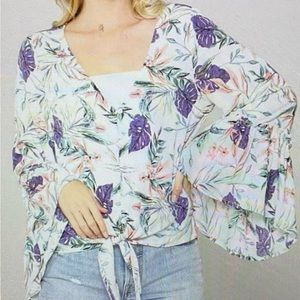 Kye Mi brand v neck top with tropical floral design. Size medium.